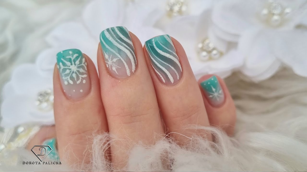 Gel polish ombre with sugared nail art. Snowflakes nail design over natural nails