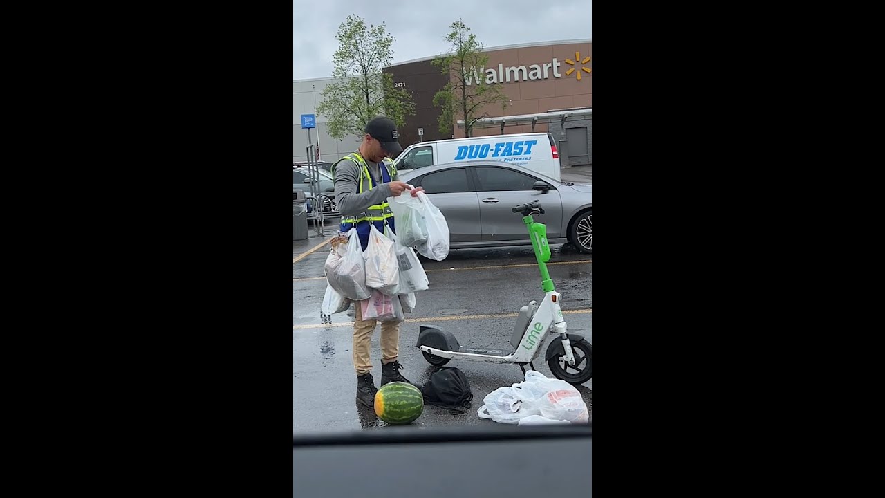 Man picks up Groceries on a Scooter!