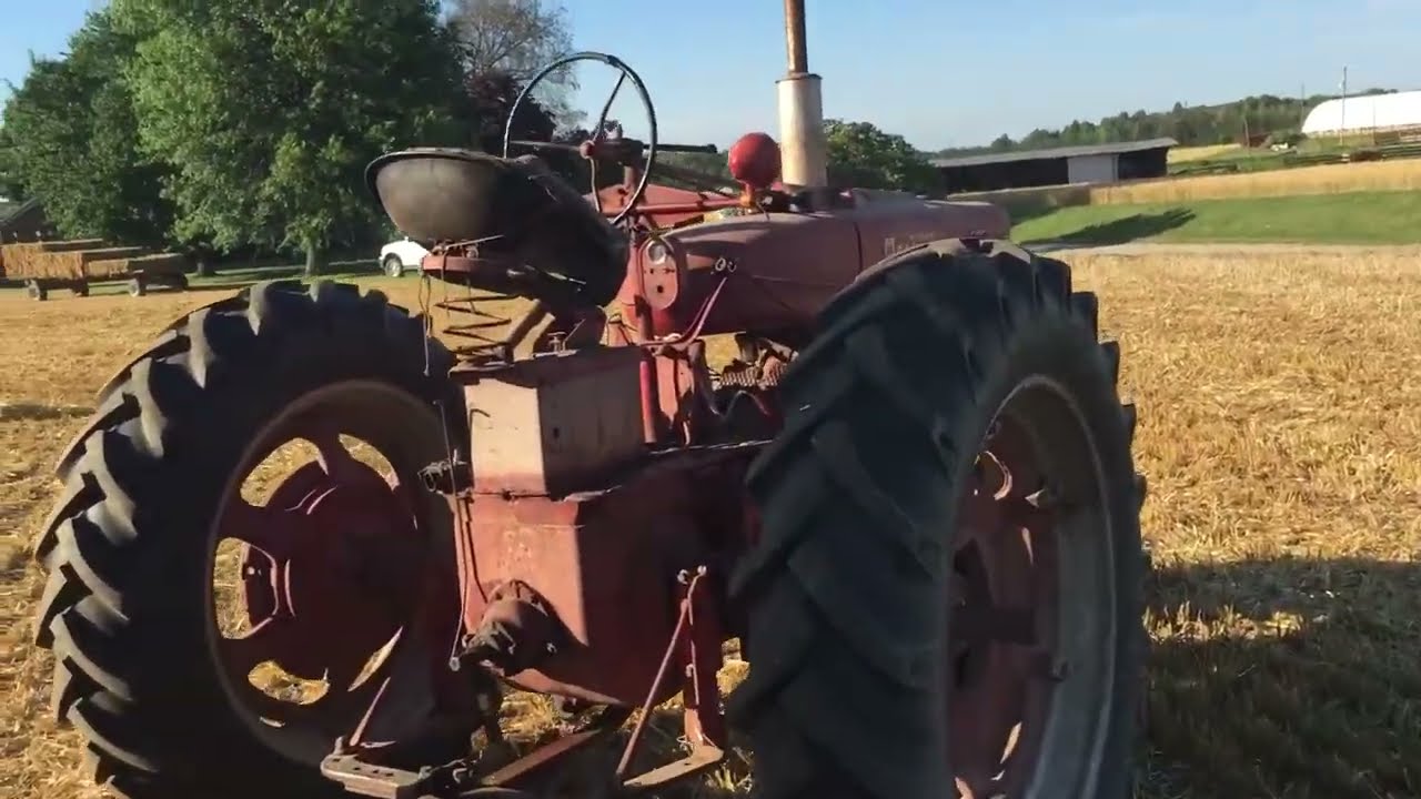 McCormick Farmall Tractor Pulling the Giant Bales of Straw
