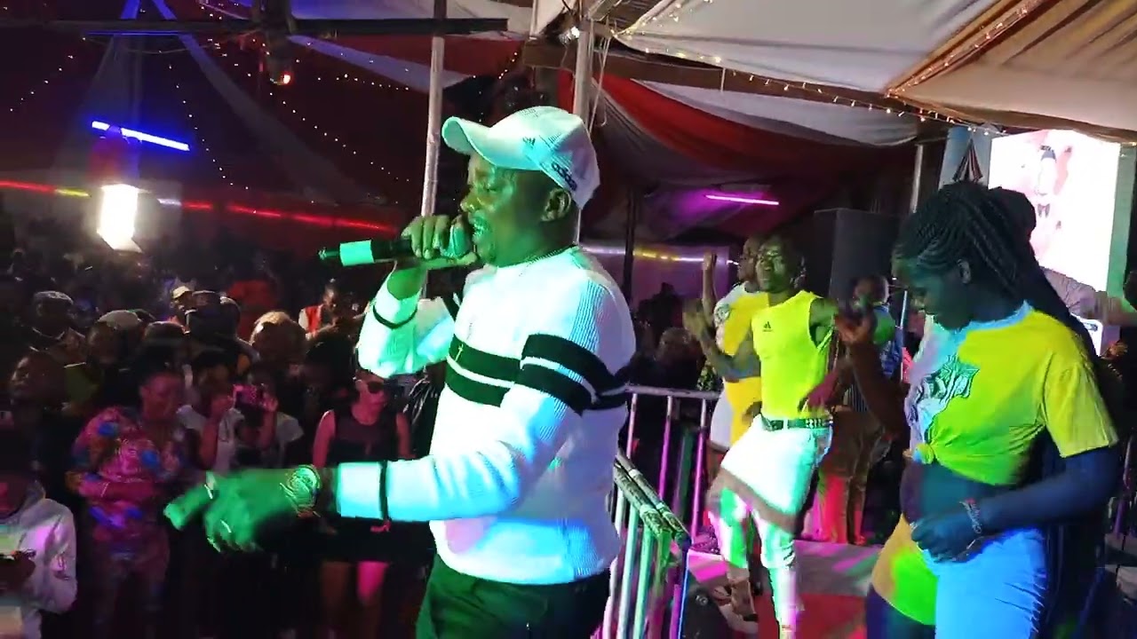 Profesa Amata Anakaribisha Emma Jalamo kwa stage NICE &LOVELY ALBUM LAUNCH