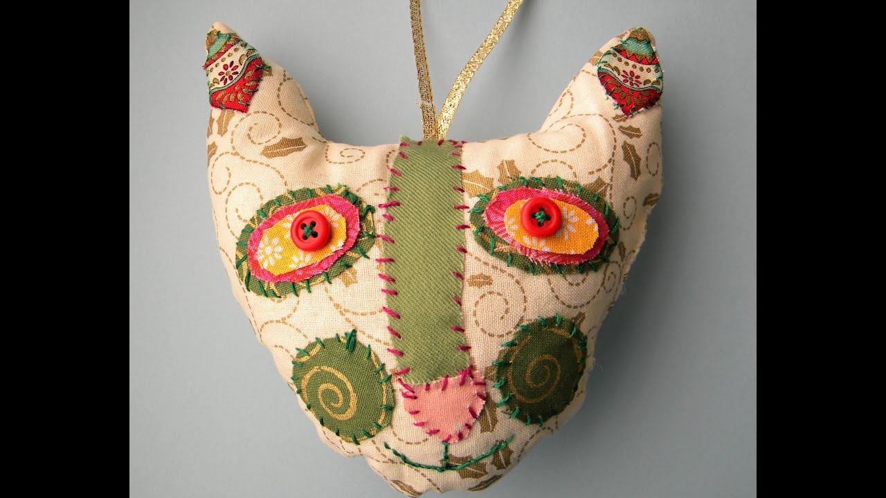 How to make a cute fabric cat ornament out of scraps.