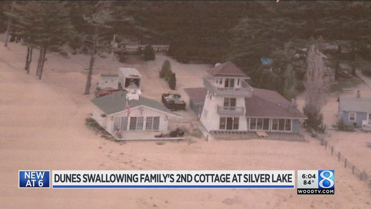 Dunes threaten family's second cottage at Silver Lake