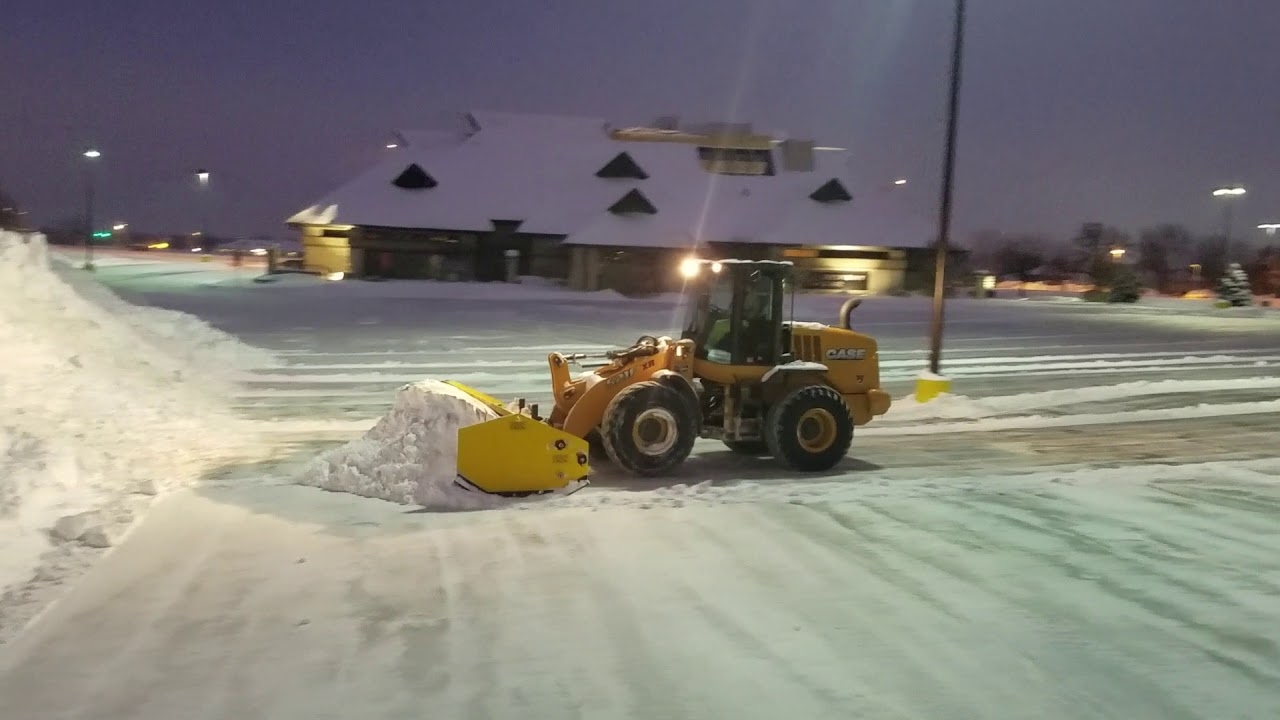 Plowing mall with Arctic Sectional Sno-Pusher 17HD