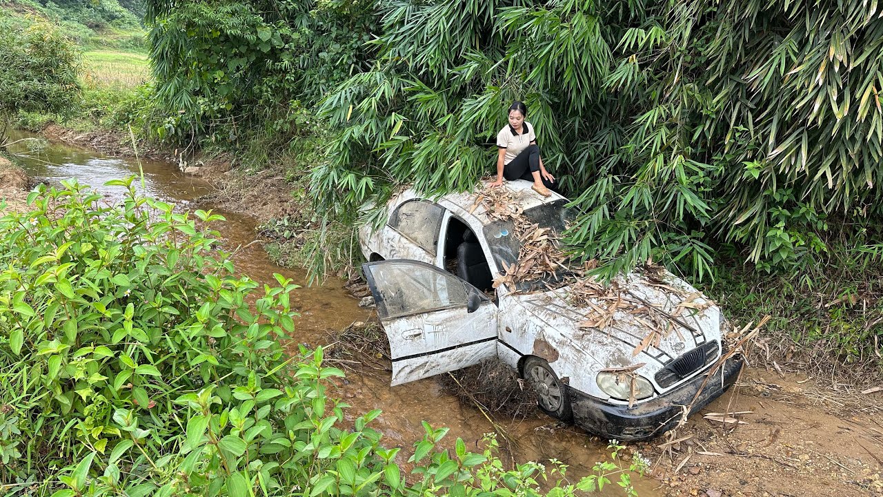 Girl mechanic revives abandoned classic supercar in stream behind mountain village