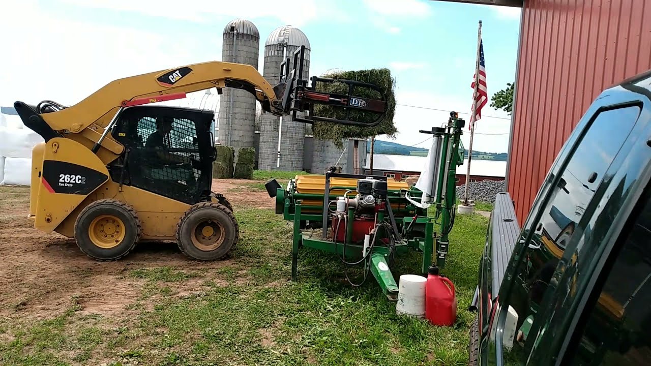 wrapping big square bales for neighbor farm