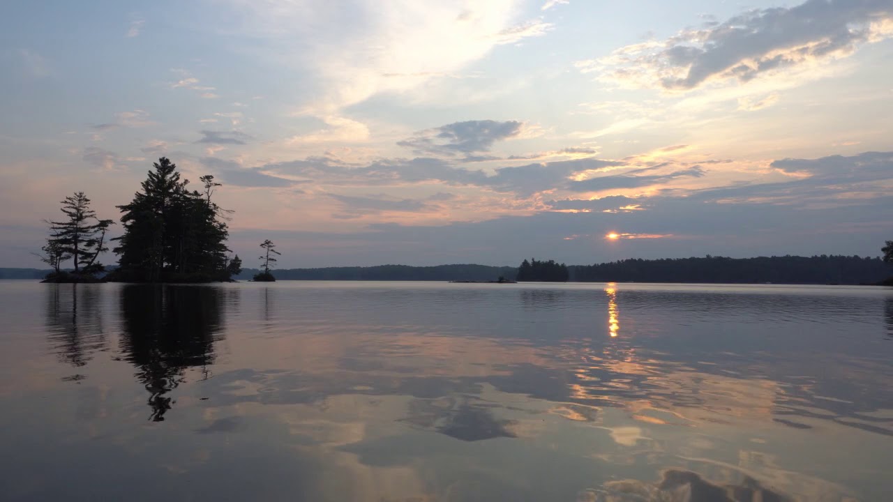 Peaceful Sunrise Over Pristine Lake