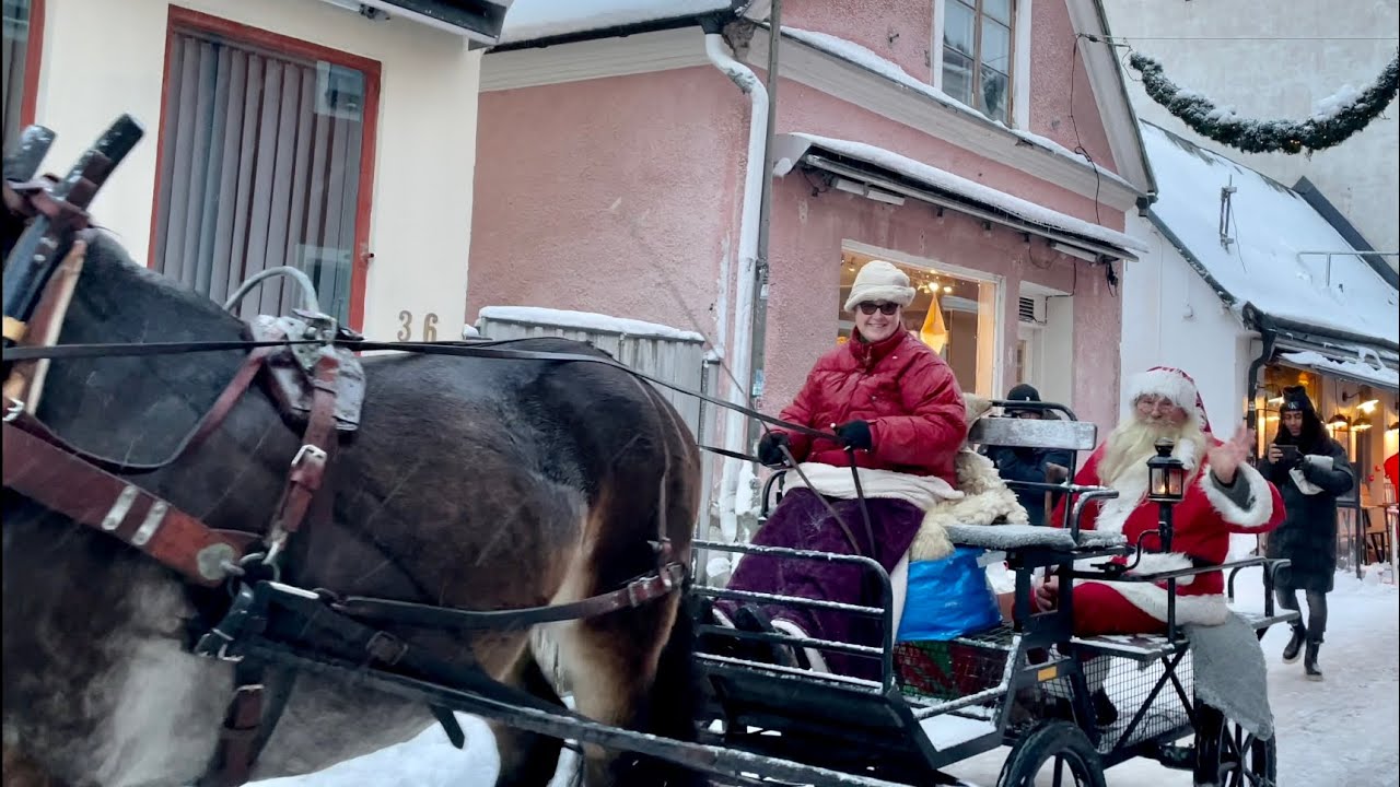 Swedish Santa Parade: Visby Tomteparad 2021. Christmas celebration in snowy world heritage town.