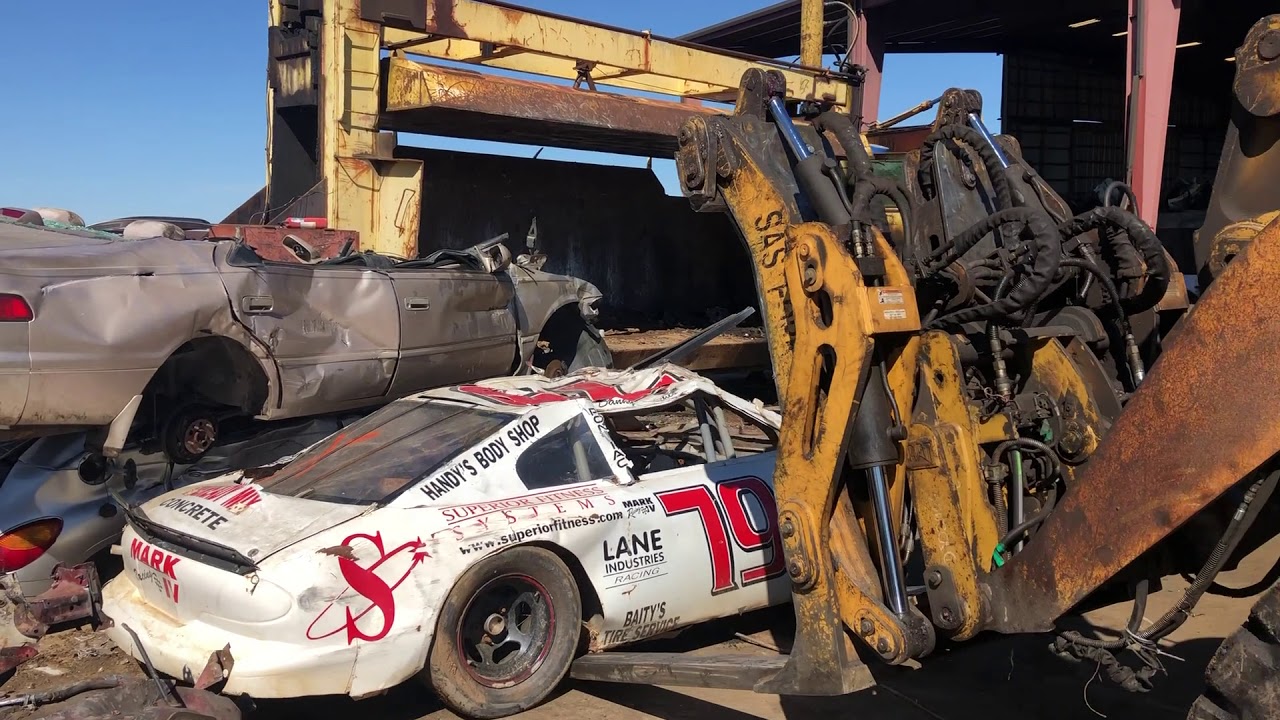 Race car verse crusher