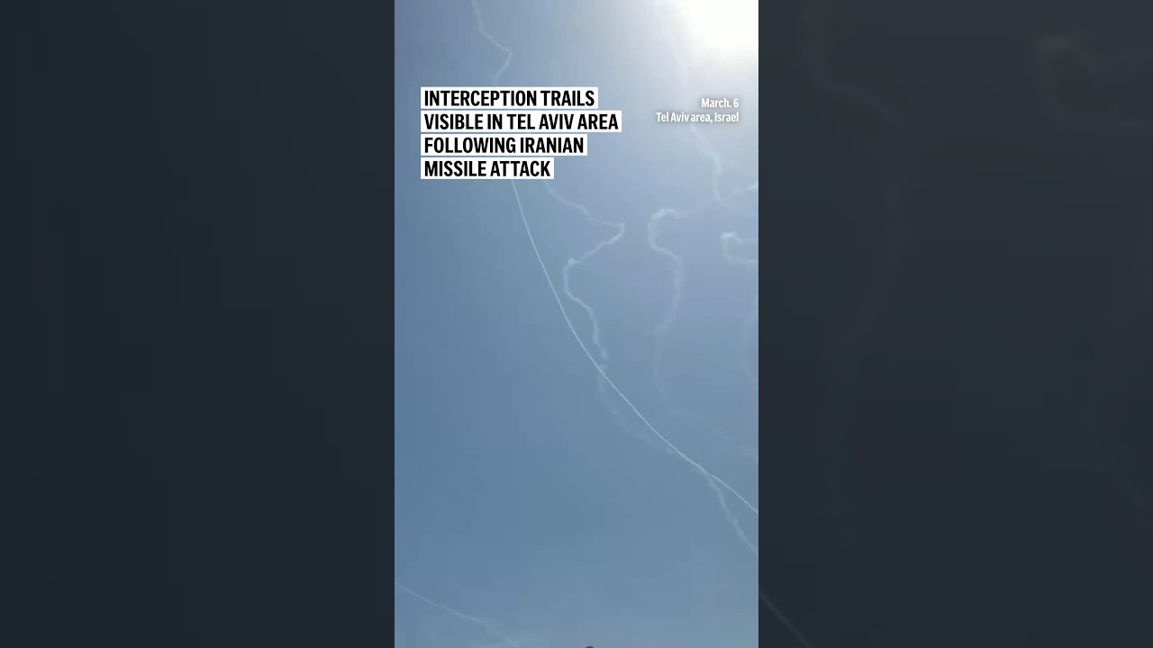 Interception trails visible in Tel Aviv area following Iranian missile attack