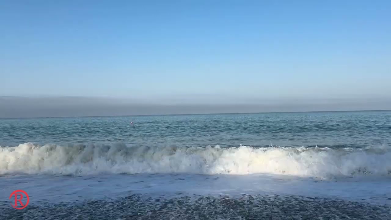 A big sea wave rolls onto the shoreSea Surf - Greatness and Peace, Power and Peace!