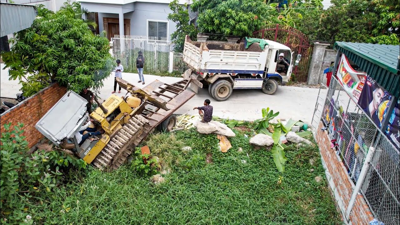 First new project!! best mini trucks unloading soil and small dozer kumatsu pushing landfill in pond
