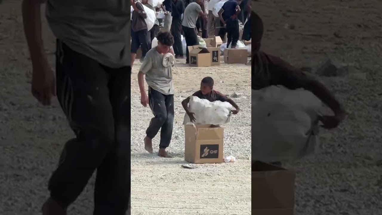 Young boy collecting aid in Gaza during hunger crisis