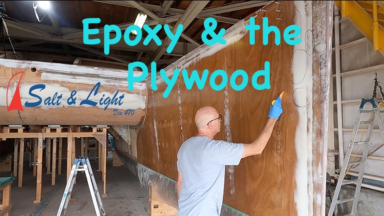 Building a plywood & epoxy DIY catamaran. Applying the epoxy coating.