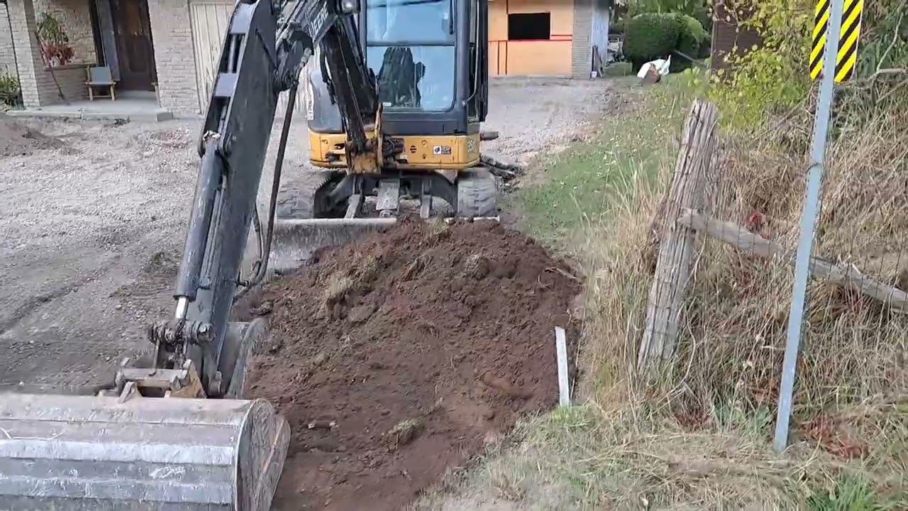 Scraping Topsoil from the East Side of the Driveway