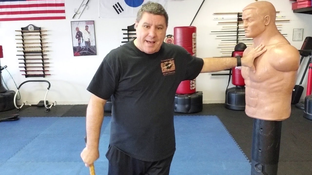 Cane self-defense with rotating the crook to hook or hit