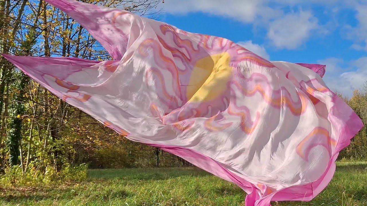 Silk flowing like a dream upon the breeze