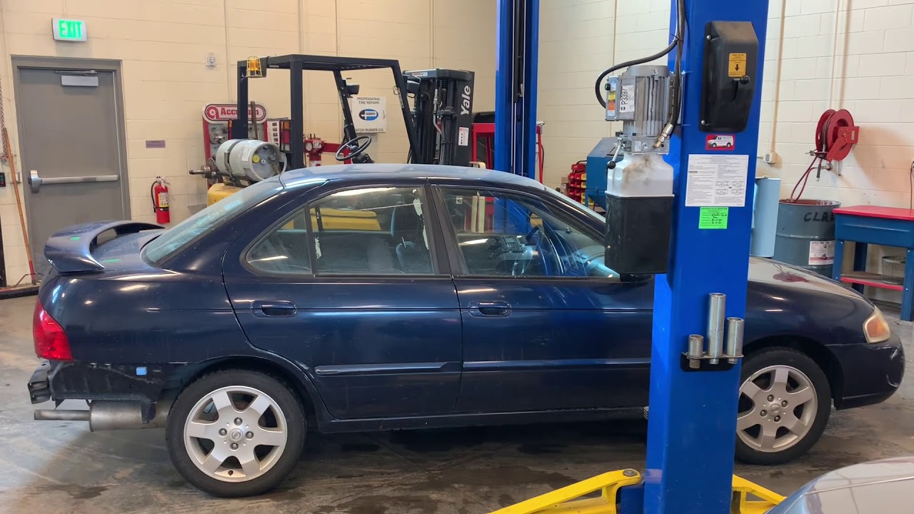How to use a 2 post symmetrical lift to raise a car.
