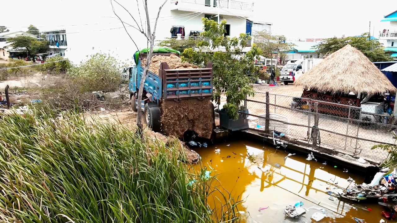 Complete the plan for small-scale machinery to pour rocks into flooded  landfills, & aquatic plants.