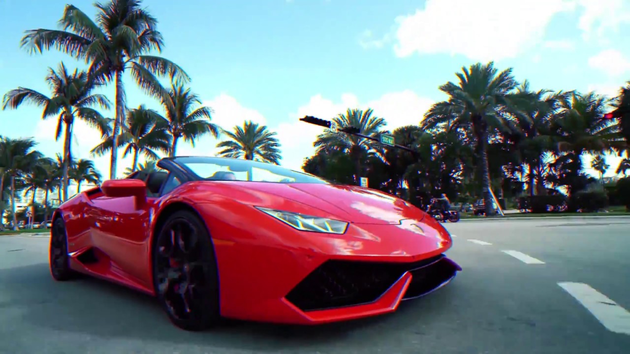 Cruising in Miami on Red Lamborghini Huracan Spyder I Paramount Luxury Rentals