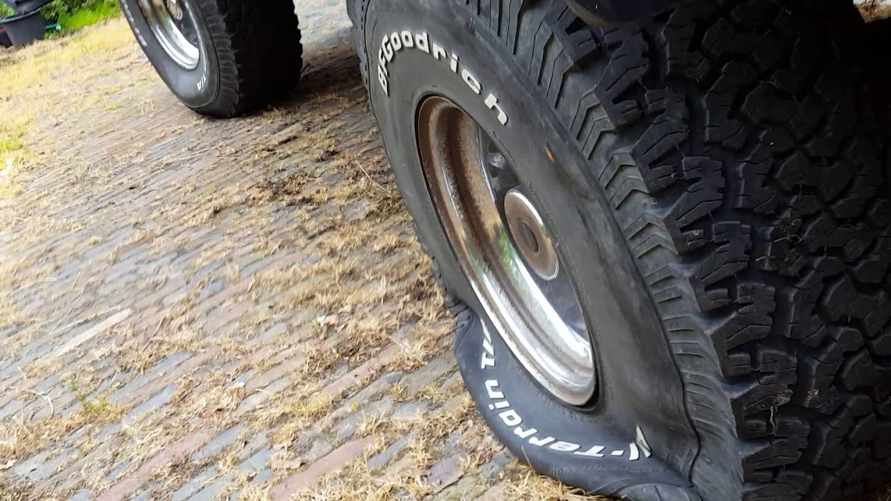 Flat Tire in the Morning . 35x12.50 is flat.
