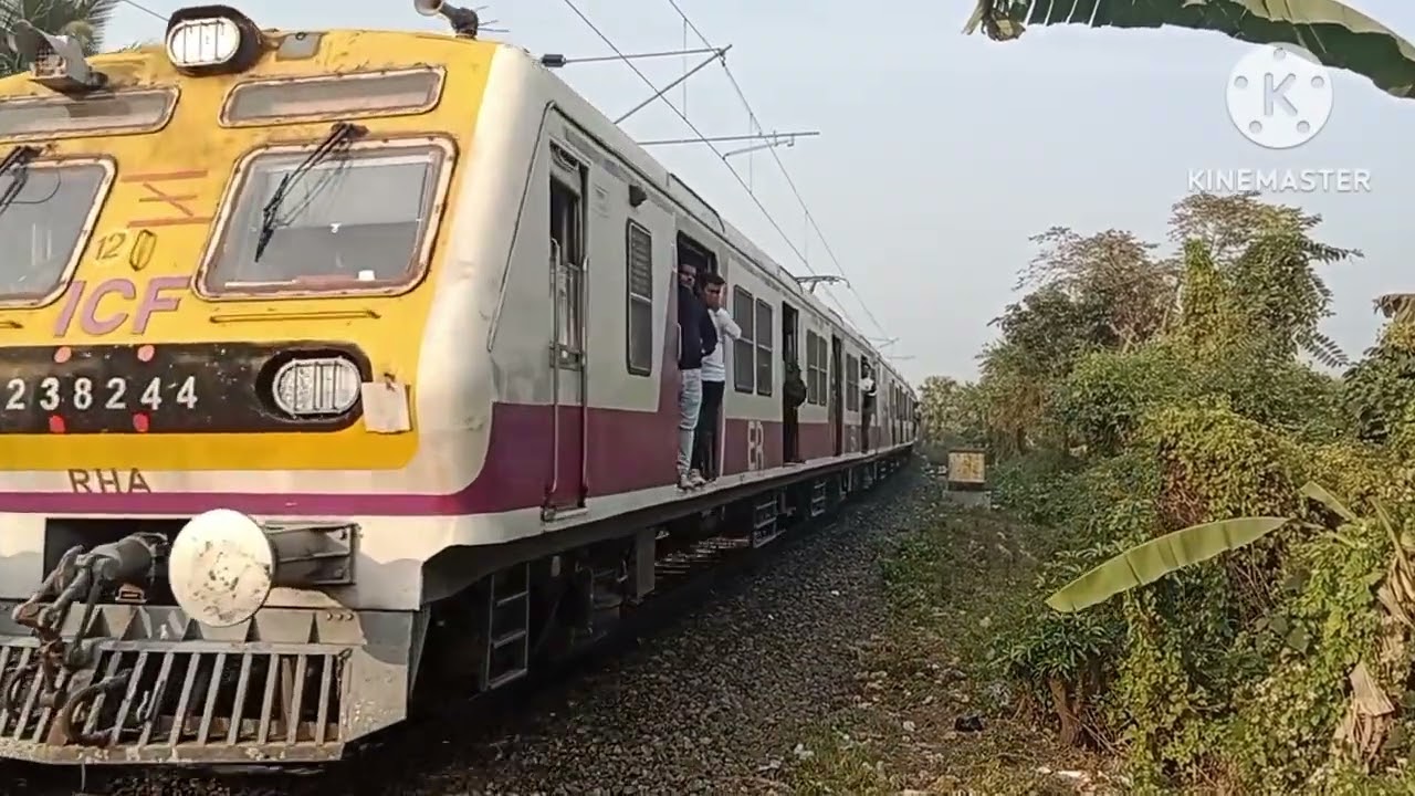Different multicoloured emu train view from curve track #crossingcabinranaghat