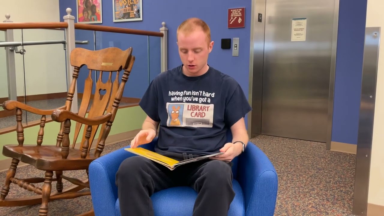 Will Schumacher Reading A Book In Urbana Little Trucks With Big Jobs by Robert Maass