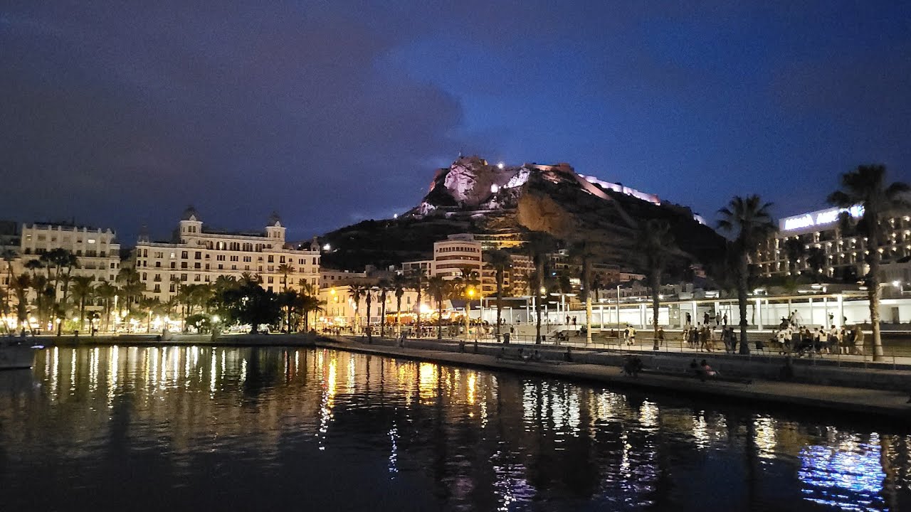 Walking along evening center of Alicante, Spain. Yacht port, Esplanada, Rambla
