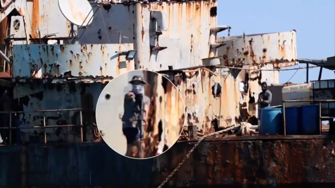 Footage shows Philippine personnel pointing guns at China Coast Guard officers