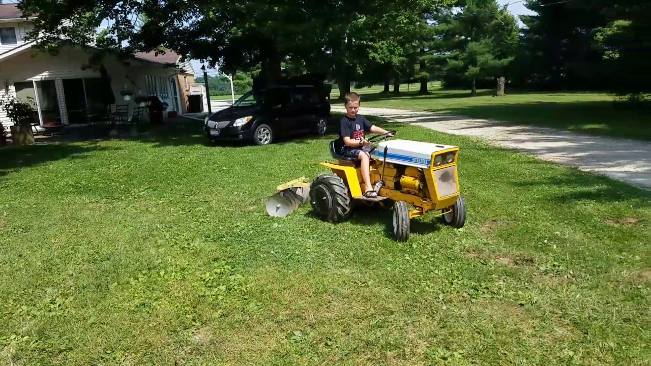 Discing with A cub cadet 125 to plant grass seed