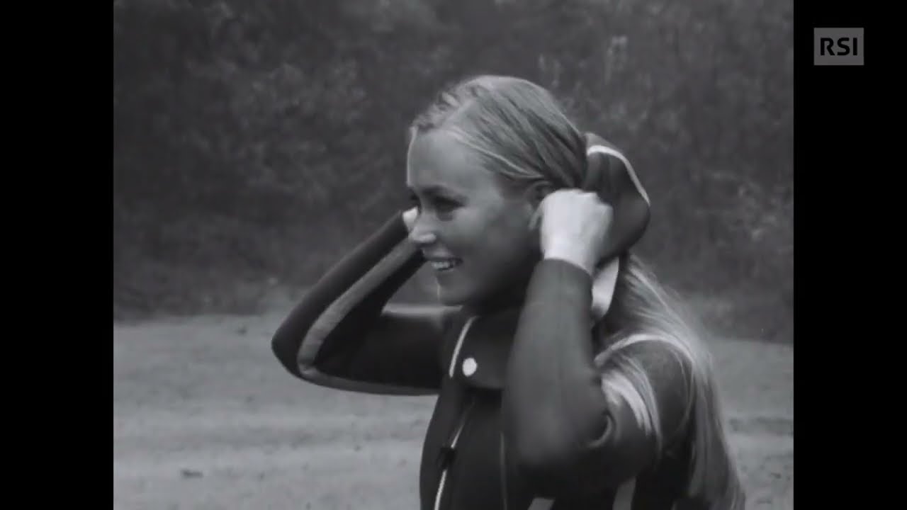 Italian lady puts on a vintage wetsuit (1971, no sound)