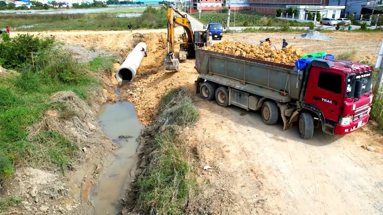 Great job !! Heavy dump truck 25T unloading soil landfill delete Drainage & bulldozer D41P pushing.