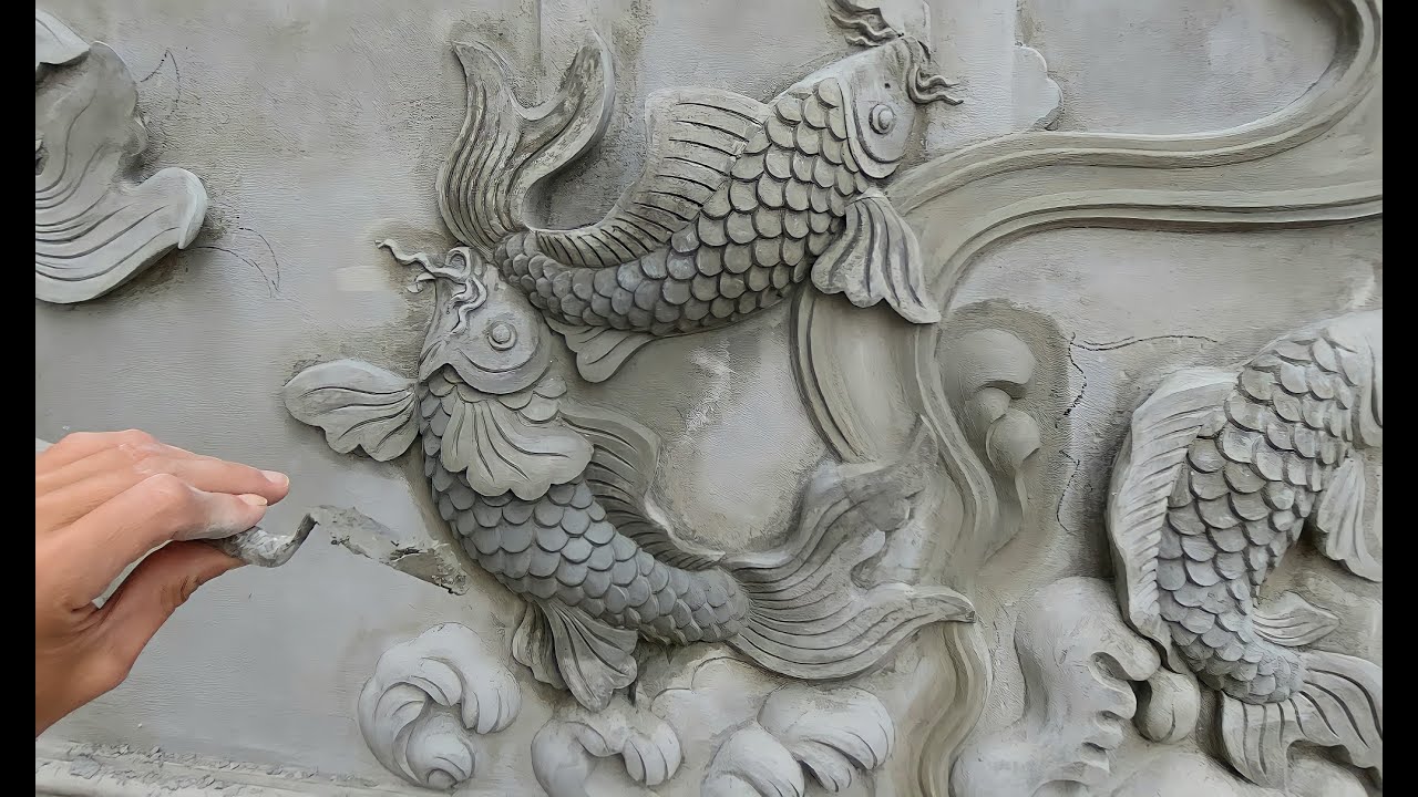 Make a bas-relief of a pair of carp / cement sand / lifelike beautiful