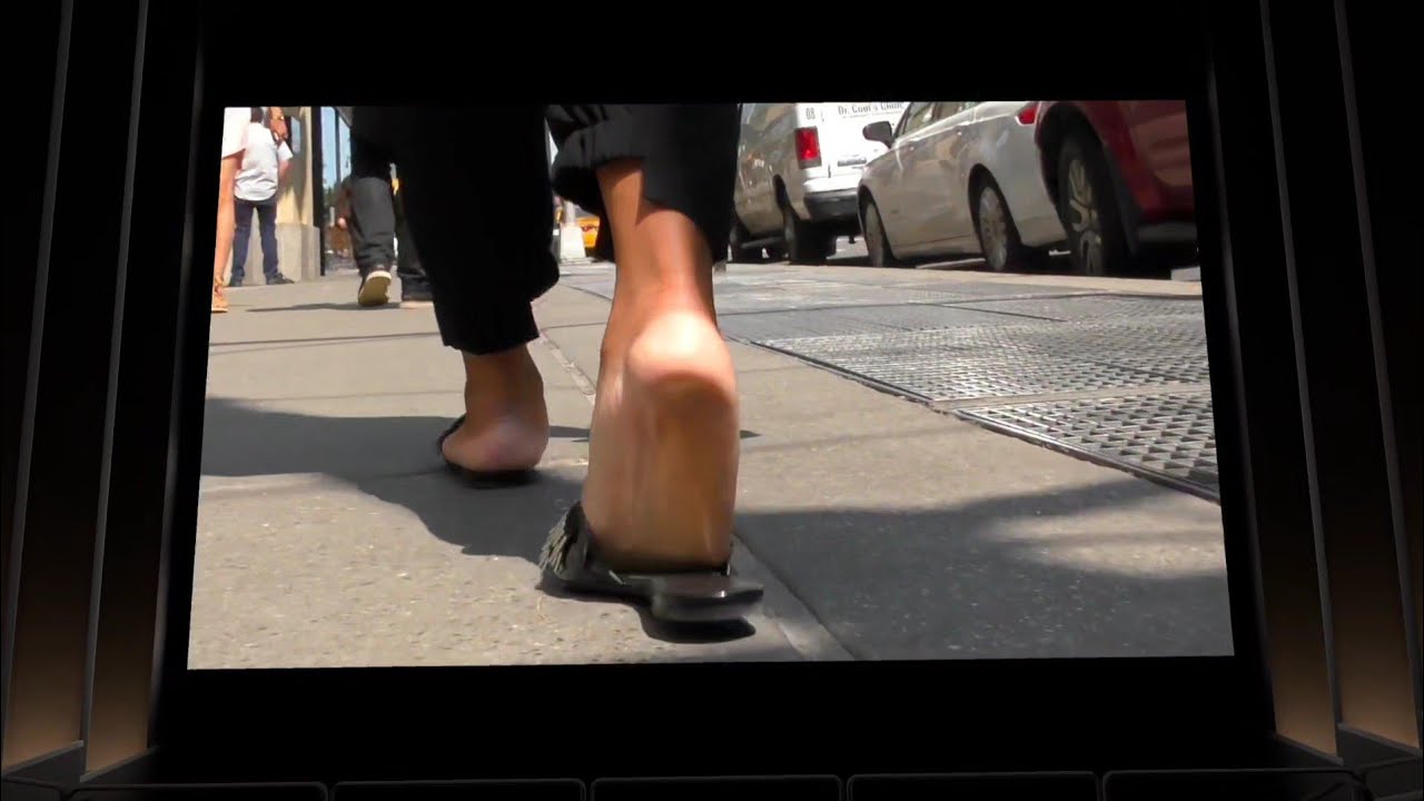 Candid Feet Walking In Black Slapping Sandals