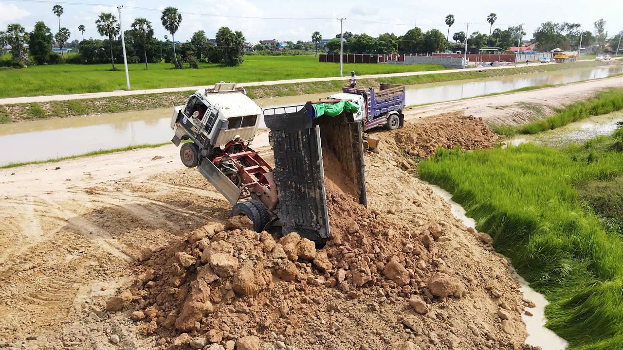 Amazing Work!! Landfill Stone Removal in Flooded Area Using D20A Bulldozer & Dump Truck