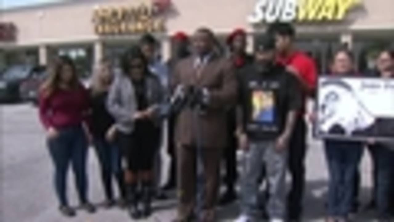 Quanell X holds press conference in front of Subway