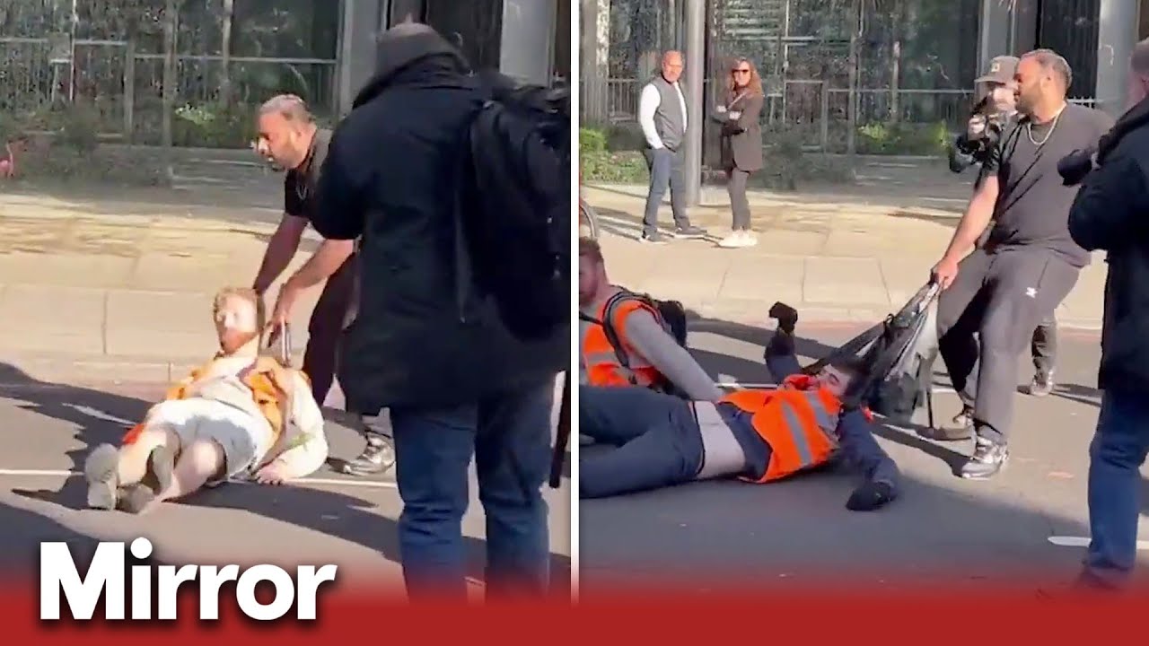 Motorists drag Just Stop Oil protesters from road