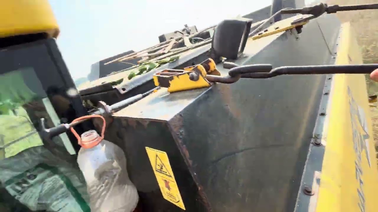 New holland Ac cabin harvester working in maize field 