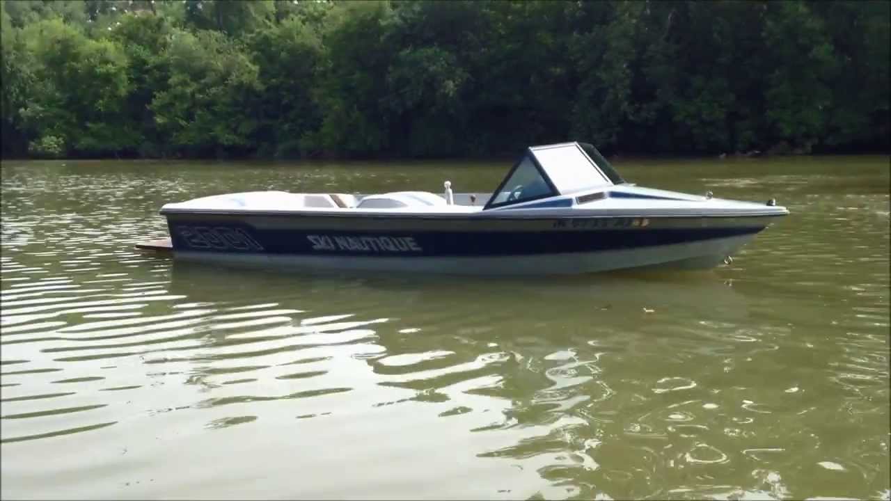 1987 Ski Nautique 2001- Navy Blue/ Silver Cloud On Water