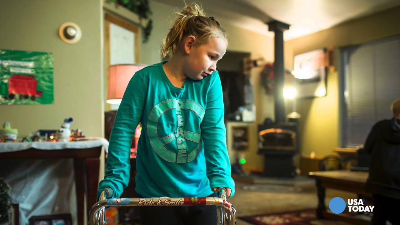 A young girl fights to walk again following enterovirus