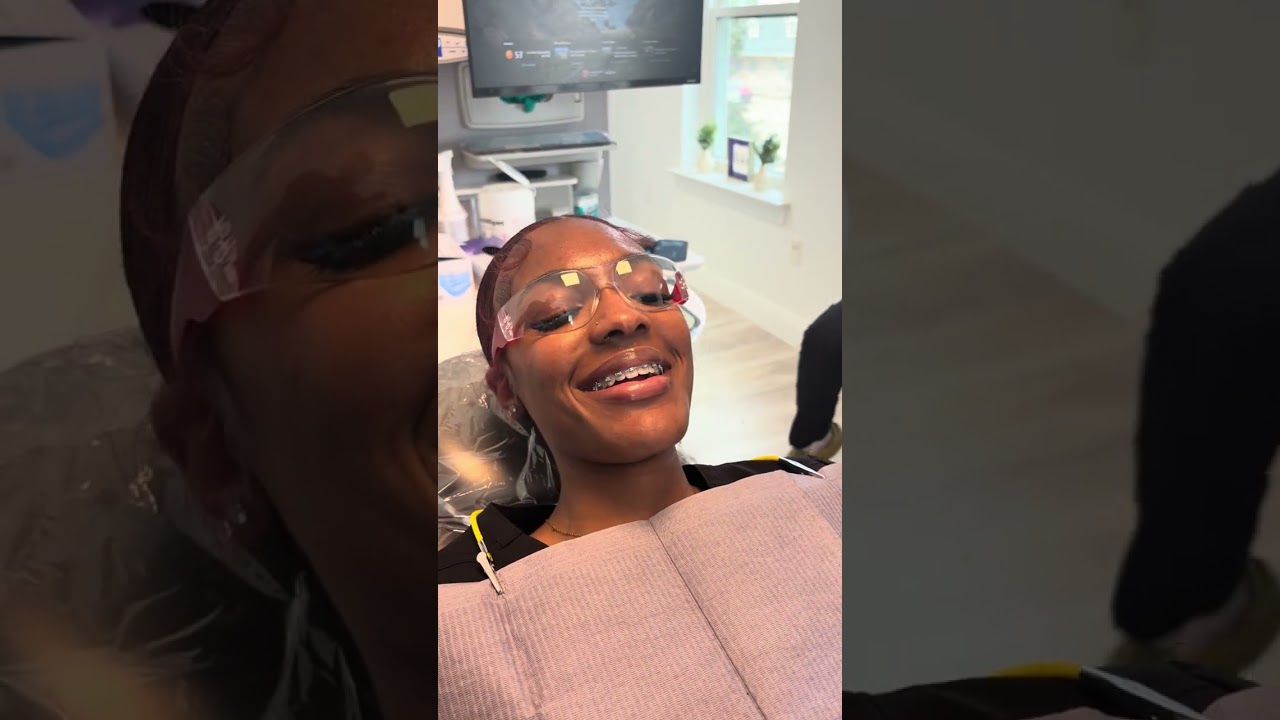 Dental assistant students learning moisture control with cotton rolls & ￼dry angles on each other.
