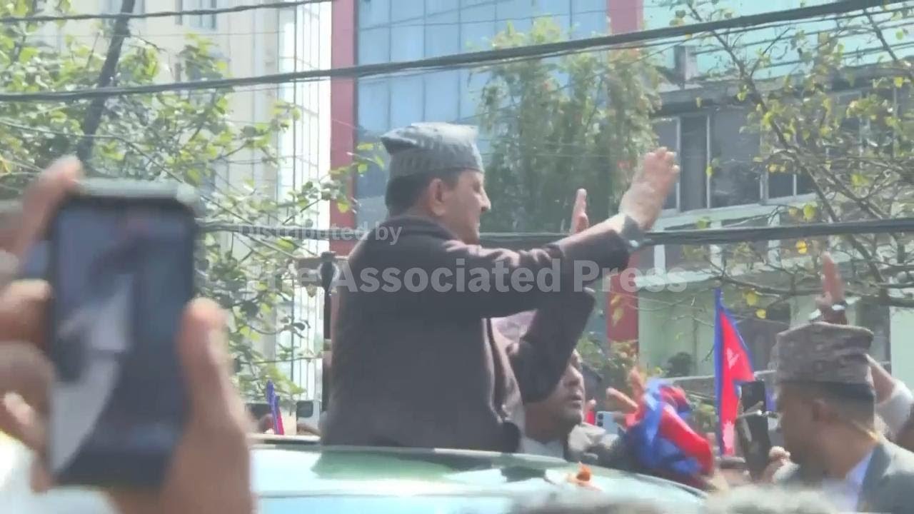 Supporters greet Nepal's former king Gyanendra Shah at Kathmandu airport