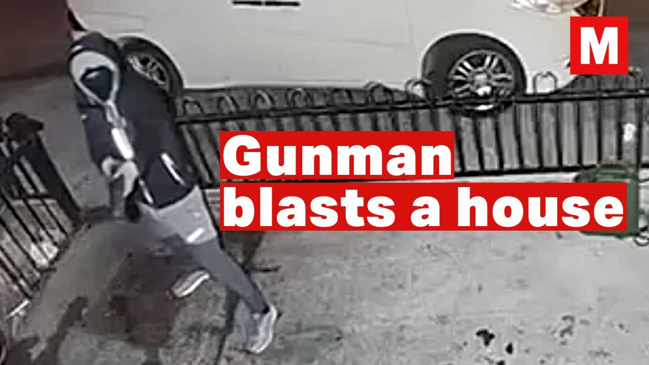This is the shock moment a gunman blasts a house as a family are asleep inside