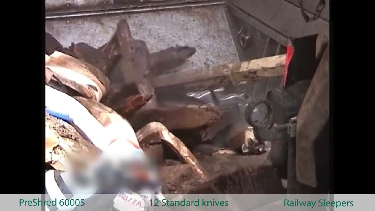 Shredding railway sleepers / railway ties  – wood waste – M&J 6000S pre-shredder
