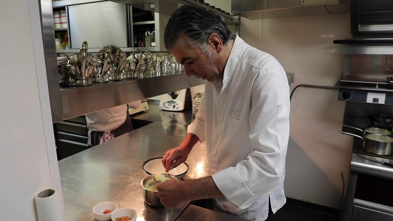 Chef Vincent Gardinal prepares a scallops dish at 1 Michelin star Restaurant Le Prieuré Saint-Géry