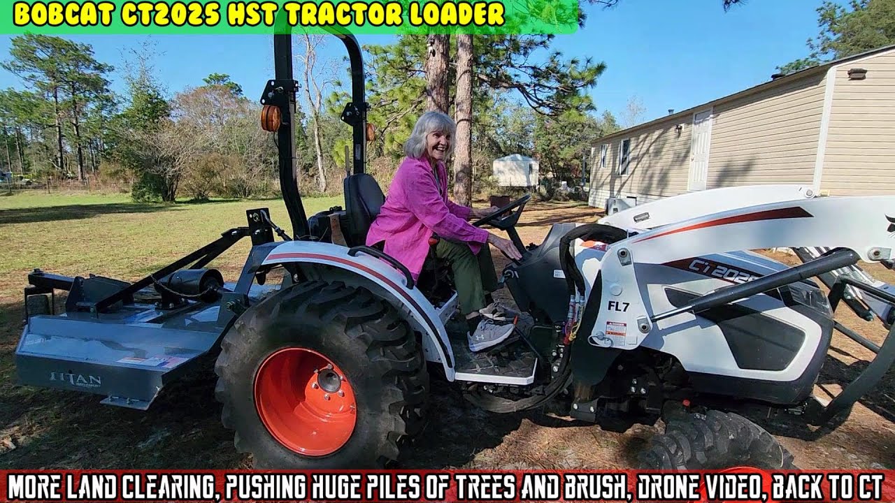 Bobcat Tractor CT2025, pushing huge piles of trees, drone video, back to CT