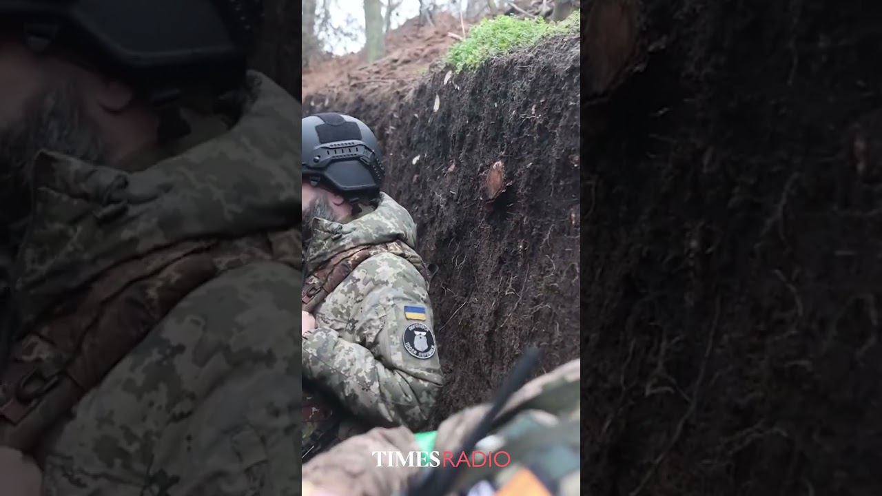 Ukrainian soldiers show trenches on the Donetsk frontline