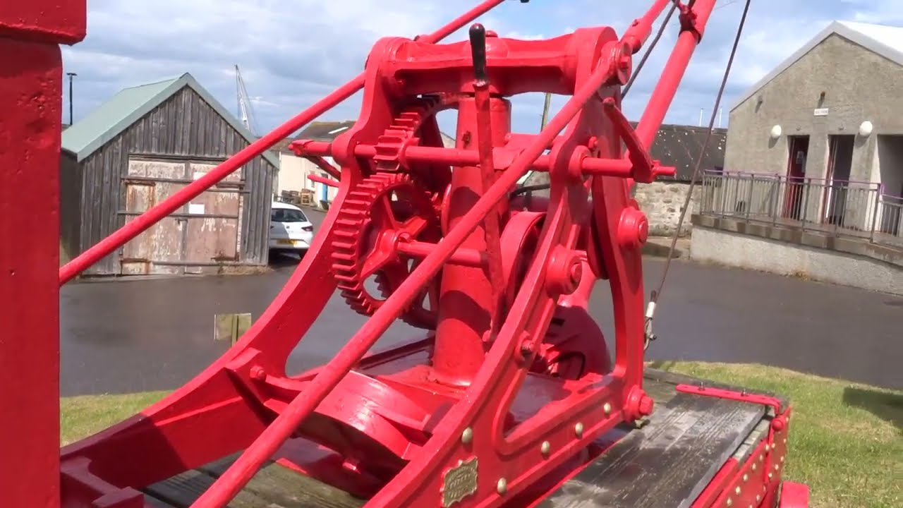 The magnificent restored historic 1856 harbour crane at Hopeman Harbour Moray Scotland