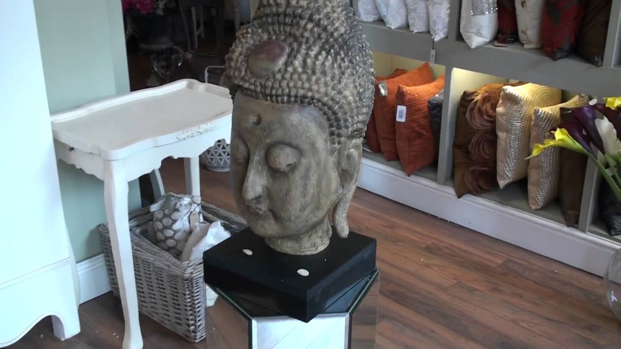 Large buddha head on a base
