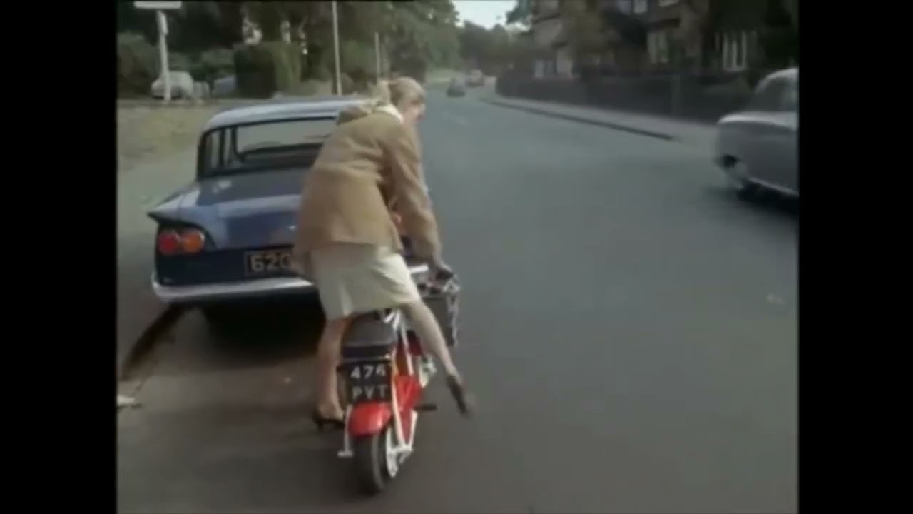 Woman Pullstart Cranking & Riding Moped