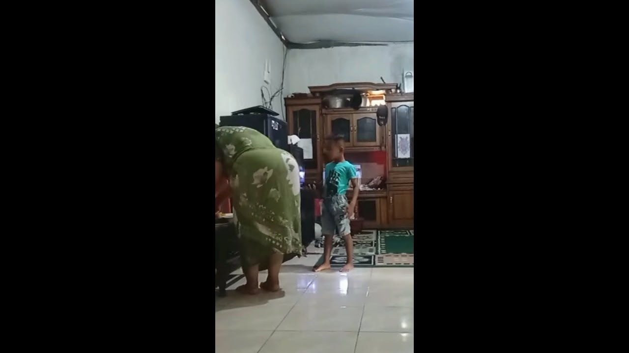 Mother Esti's rotine at her sister's house is sweeping the house and cleaning the house